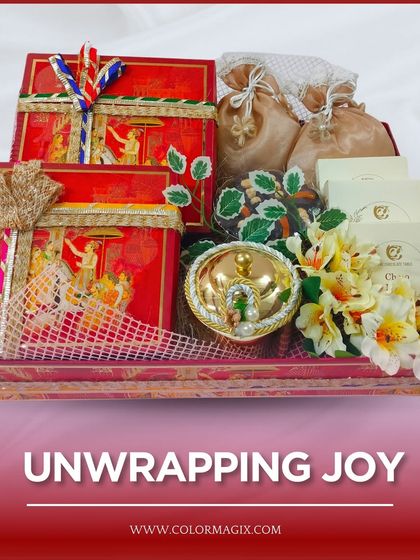 A tray hamper featuring red boxes with traditional Indian artwork, perfect for presenting shagun or other ceremonial wedding gifts.