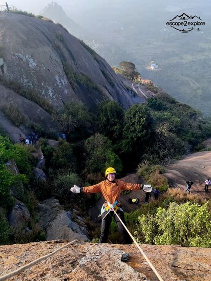Another adventurer enjoying the controlled descent down the massive rock at Uttari Betta.