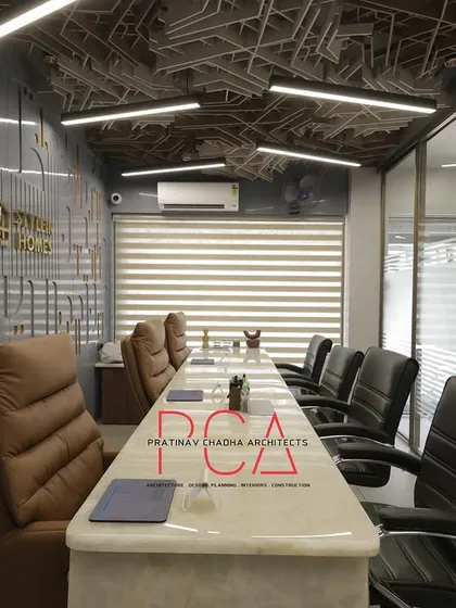 This conference room for StyleIn Homes in New Delhi showcases my approach to creating innovative corporate spaces. The design is centered around free-flowing shapes, featuring interweaving acoustic ceiling panels that are both visually stunning and highly functional for sound management in a busy office.