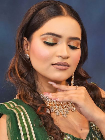 Another angle of the golden-green eye makeup. The shimmer catches the light beautifully, making the eyes sparkle.