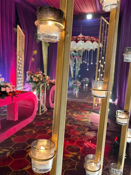 A close-up of candle-lit details along a walkway, showcasing how we use small touches to build a warm and inviting atmosphere.
