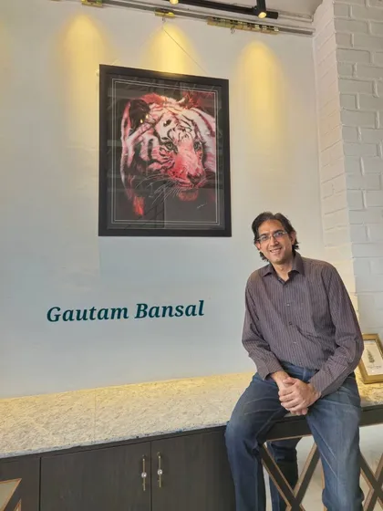 Artist Gautam Bansal is pictured with his striking charcoal tiger portrait, an example of the talented creators we are proud to feature and promote through solo and group exhibitions.
