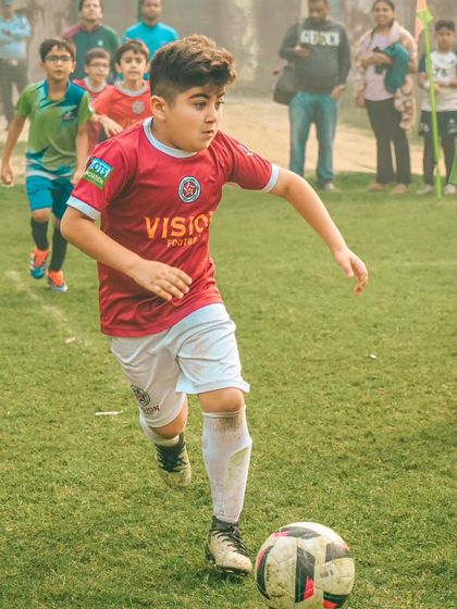 Driving forward with pace and power. This player exemplifies the attacking mindset we encourage at the academy.