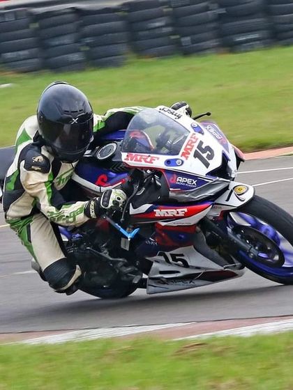 Competing in the Stock 165cc Girls category, Poojita AK leans her Yamaha R15 into a corner at the Madras Motor Race Track. This performance secured her valuable points in the 2023 national championship.