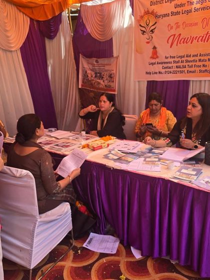 At the legal aid and assistance stall organized by DLSA Gurugram during Navratri at Sheetla Mata Mandir. Festivals are a great time to connect with the community and offer our services.