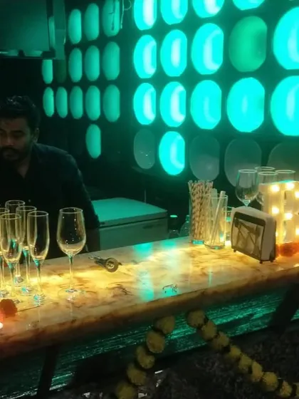 Our head mixologist, Gopi, at a Diwali party in Khar. The bar is decorated with marigolds and diyas to match the festive theme.