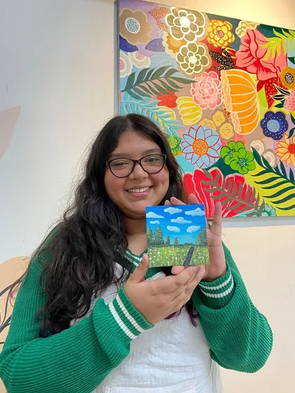 A young participant with her charming miniature landscape painting. Art is for all ages, and I love seeing creativity blossom in everyone.