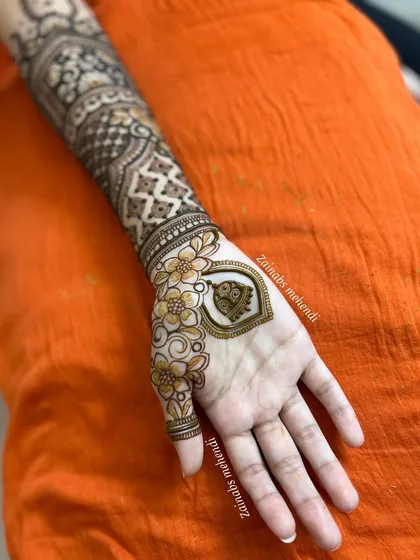 A unique bridal design for Maheen, featuring a central motif on the palm with negative space.