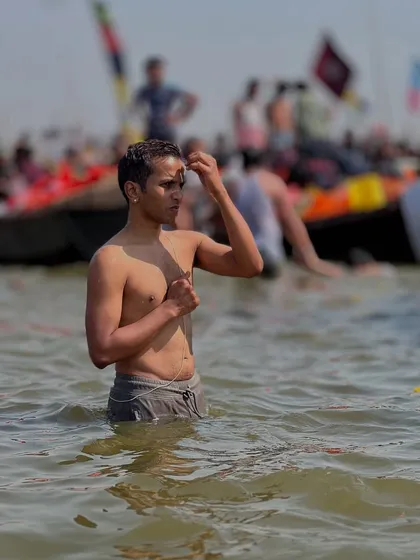 A moment of prayer and reflection after the holy dip in the Ganga. The water is not just water; it is a carrier of immense spiritual energy. I am bringing back this holy water for all my students who could not make it.