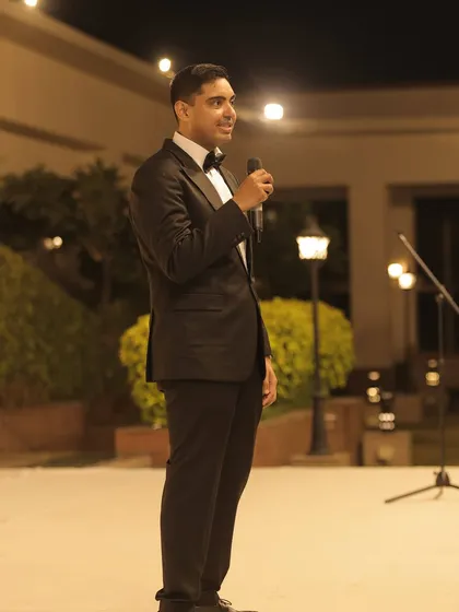 The groom delivering a heartfelt speech under the starry sky.