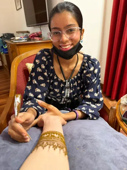 Here I am, in my element, applying an elephant band design for a client from Japan. This is how art travels without language.