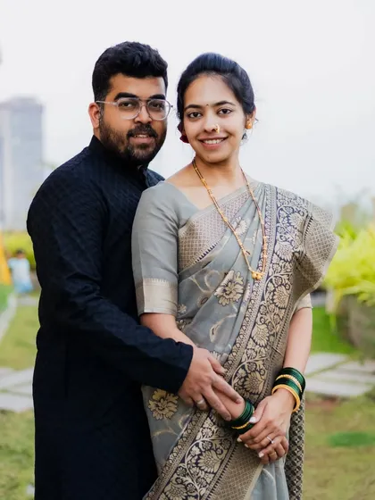 A classic portrait of a couple in elegant traditional Indian attire. They look so happy and comfortable together.