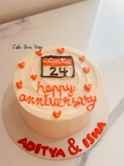 A cute and simple anniversary cake with a calendar marking the special date.