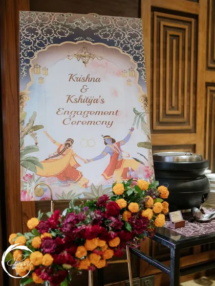 A closer look at the custom-designed welcome sign, showing the intricate details of the artwork and the elegant floral arrangement at its base.
