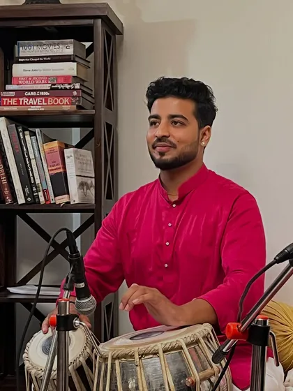 A candid shot while accompanying a singer during a house concert.
