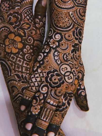 The back design for the previous post, featuring the initials 'SJ' in a heart. The floral and paisley patterns are a classic Indo-Arabic style.