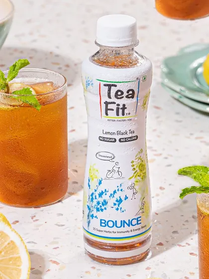 A closer shot of the Tea Fit iced tea, focusing on the condensation on the glasses and the fresh mint garnish. This detail-oriented styling makes the drink look incredibly refreshing and thirst-quenching.
