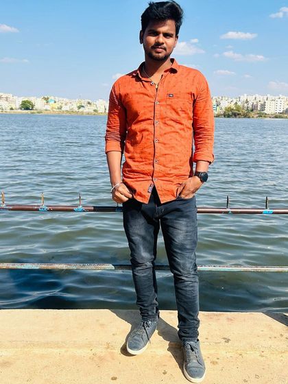 A full-length shot on the pier at Madiwala Lake, a popular spot for locals.