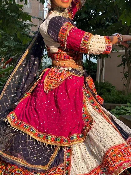 A close-up of the outfit in motion, showing the texture and sparkle of the fabric.