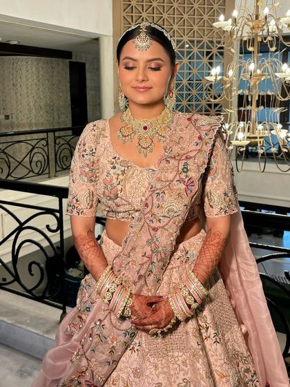 A close-up of Rashi's serene expression. The makeup is blended seamlessly, creating a flawless finish.