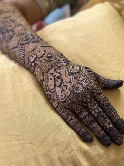 The full hand view, showing how the name is integrated into the overall design.