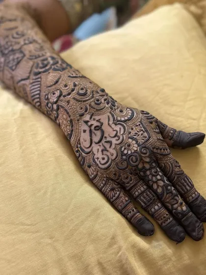 The full hand view, showing how the name is integrated into the overall design.