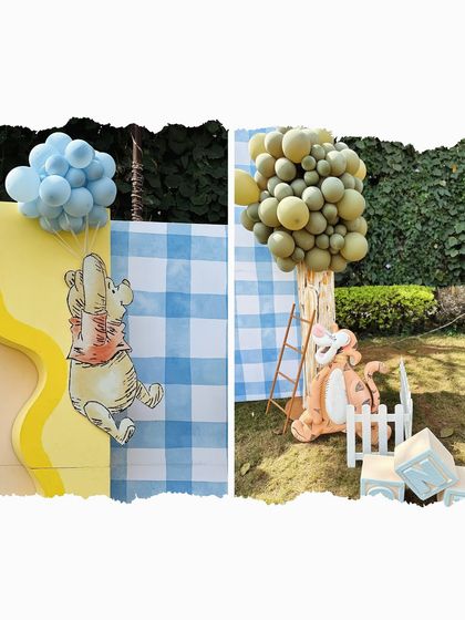 Character cutouts of Pooh Bear floating with a balloon and Tigger near a tree made of balloons. These life-sized props make the story come alive.