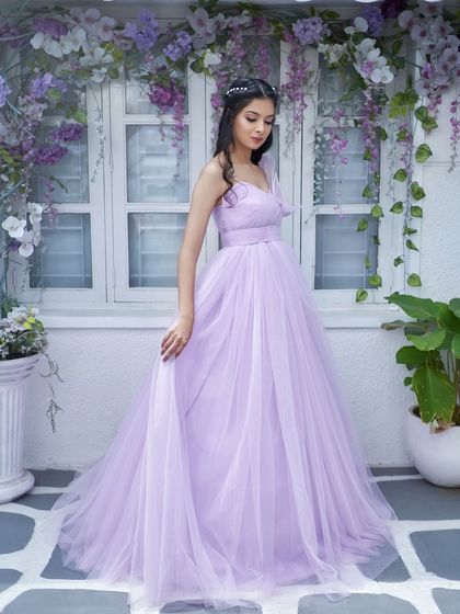 A full-length view of the 'Gorgina' gown. The simple, flowing tulle skirt perfectly balances the intricate, hand-embroidered 3D leaves on the bodice.