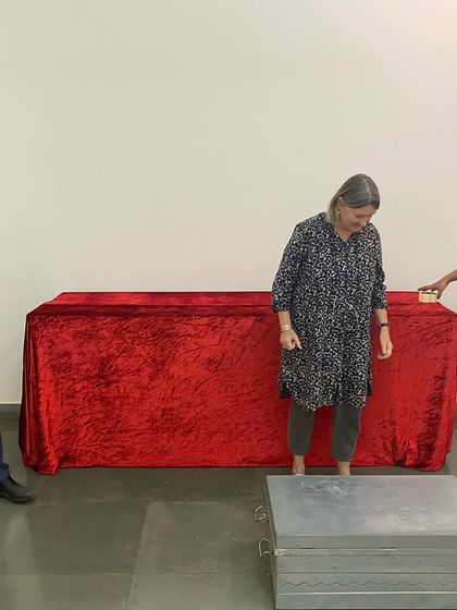 Clare Arni and the team setting up the prop tables for her interactive exhibition.