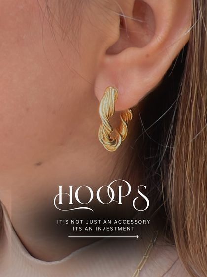 Hoops are not just an accessory, they are an investment. This image showcases our twisted gold hoops, a chic and modern take on a classic design that is perfect for any occasion.