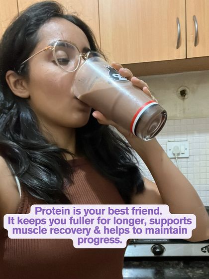 A shot of me drinking a protein shake. Protein is your best friend for staying full and supporting muscle recovery. I make it a non-negotiable part of my day.
