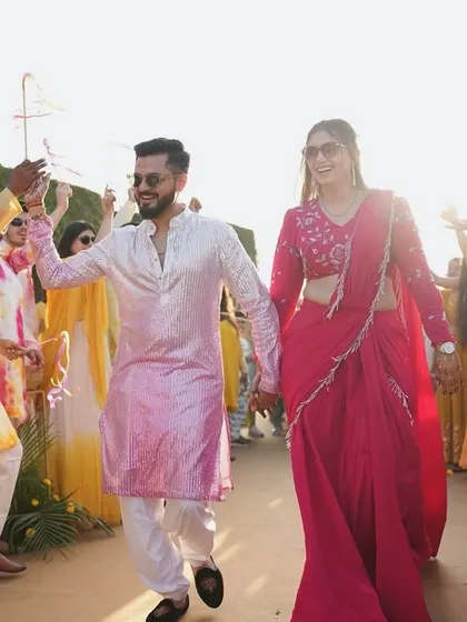 A beautiful couple's entry with friends and family. The coordinated outfits and happy faces show the amazing vibe of this pre-wedding brunch.