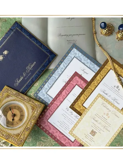 This invitation suite exudes an air of understated royalty. We used a palette of rich jewel tones, inspired by the bride's attire for each event, and paired it with elegant patterns and gold foiling to create a truly regal first impression.