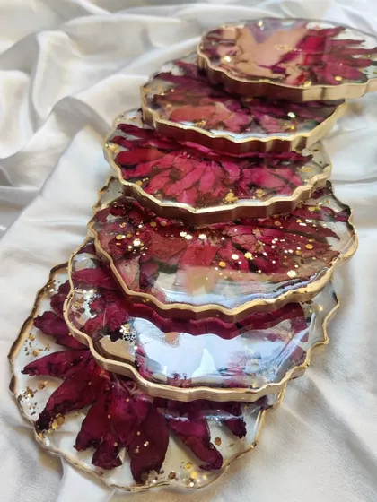 These images and videos showcase my bulk order capabilities, from colorful keychains to elegant floral coasters. Each item can be customized to fit your event's theme and budget.
