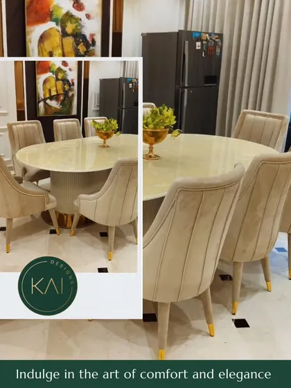 An elegant ten-seater dining arrangement we created for a client's home. The set features a polished oval marble tabletop and plush, channel-tufted chairs with gold-tipped legs, designed for both grand entertaining and everyday comfort.