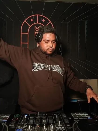 Another angle of me in the zone, with my arm raised, feeling the energy of the room.