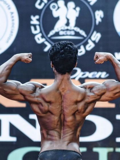 A shot of my back development from an earlier competition. Every show is a chance to bring a better, more refined version of myself to the stage.