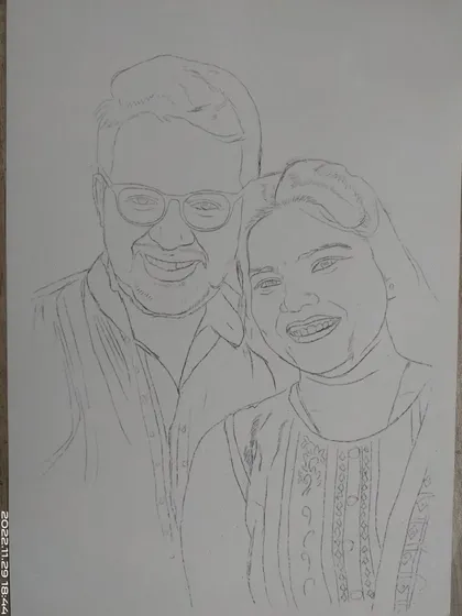 This is the initial outline stage for a couple's portrait. I use a grid to lightly sketch the placement of the features and outlines before committing to darker lines and shading.