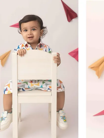 A collage from the paper plane session, showing this little guy sitting and posing with his colorful props.