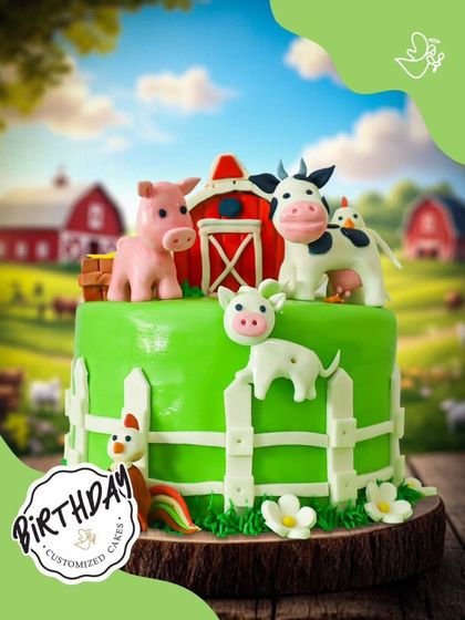 Life on the farm is sweet with this adorable cake. It features a pig, cow, and chicken in front of a red barn, all made from colorful fondant.