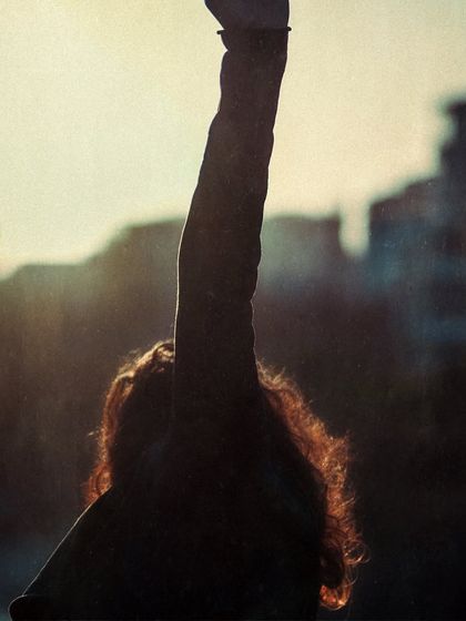 A silhouette against the setting sun, capturing the expressive arm movements of Flamenco.