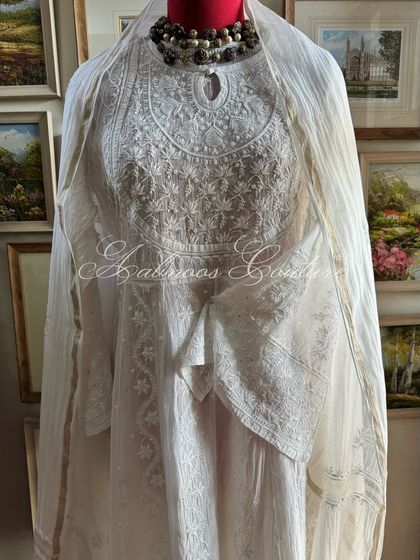 A full-length view of the Anarkali on a mannequin, demonstrating its graceful and timeless silhouette.