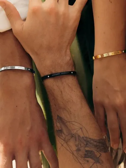 Showcasing the versatility of my bracelets for everyone. Here you can see three different wrists wearing our adjustable cuffs in Silver, Black, and Gold finishes, proving they are truly unisex.