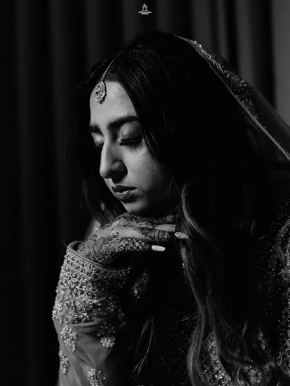 A duplicate of ID 60, this dramatic black and white portrait captures a Muslim bride's contemplative mood.