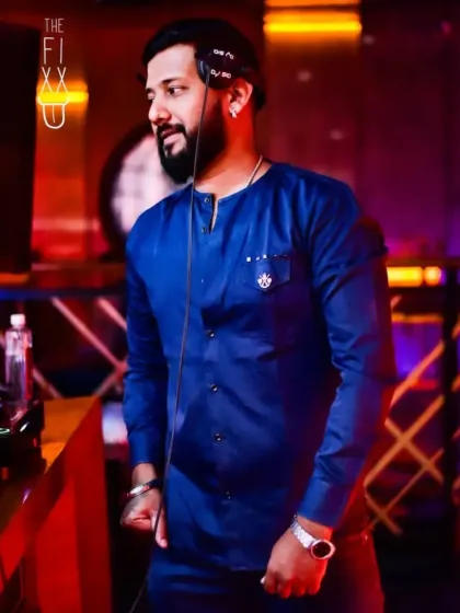 A side profile shot, focused on the music and the energy of the night.