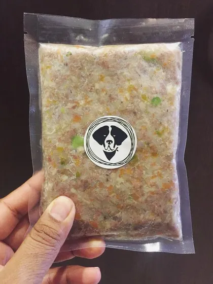 This is what fresh dog food looks like. You can see the real ingredients through the clear, vacuum-sealed pack. It's a complete meal, ready to serve.