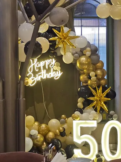 A side view of the 50th birthday decor, showing how it integrates into the venue's aesthetic.