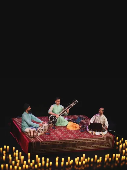 The candle-lit stage at The Bhavan in London, with my fellow musicians. The setup creates an intimate and sacred space for the music.