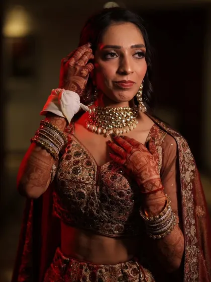 Another angle of this beautiful engagement hairstyle and makeup. The warm lighting highlights the texture in her hair and the glow of her skin.