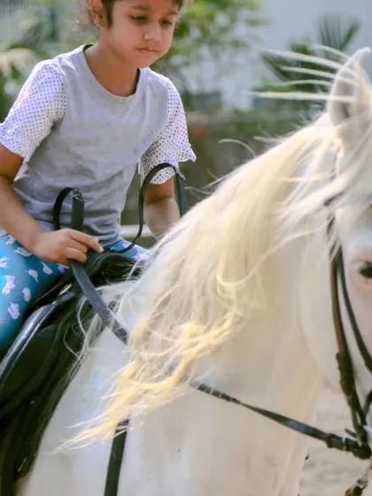 A duplicate of 111, showing a young rider's focus. We ensure every child feels secure and empowered in the saddle.